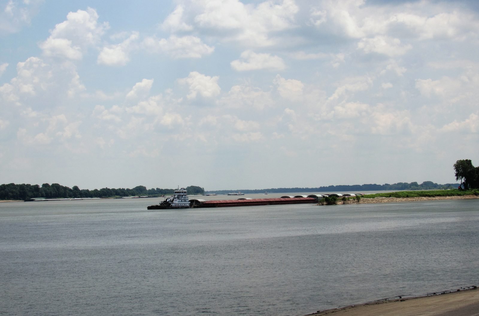 A towboat pushing barges where the Tennessee River meets the Ohio at Paducah